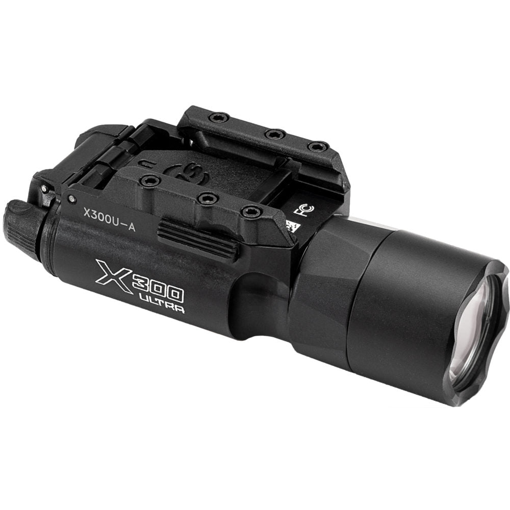 A tactical weaponlight with a black polymer body and red LED lens mounted on an AR-15 rifle barrel by Surefire.