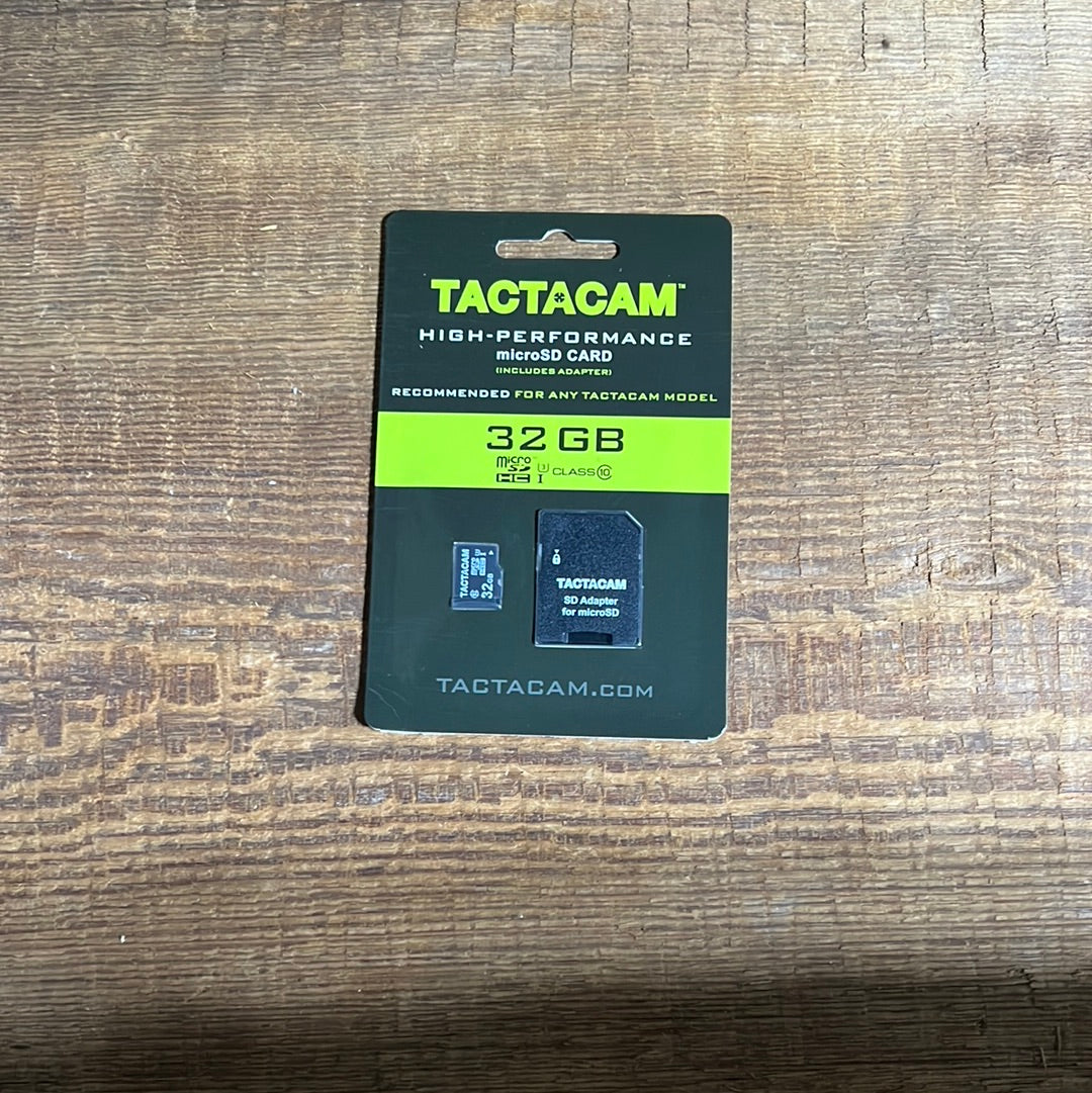 Tactacam 32GB High Performance microSD Card packaging with included adapter, displayed on a wooden surface.