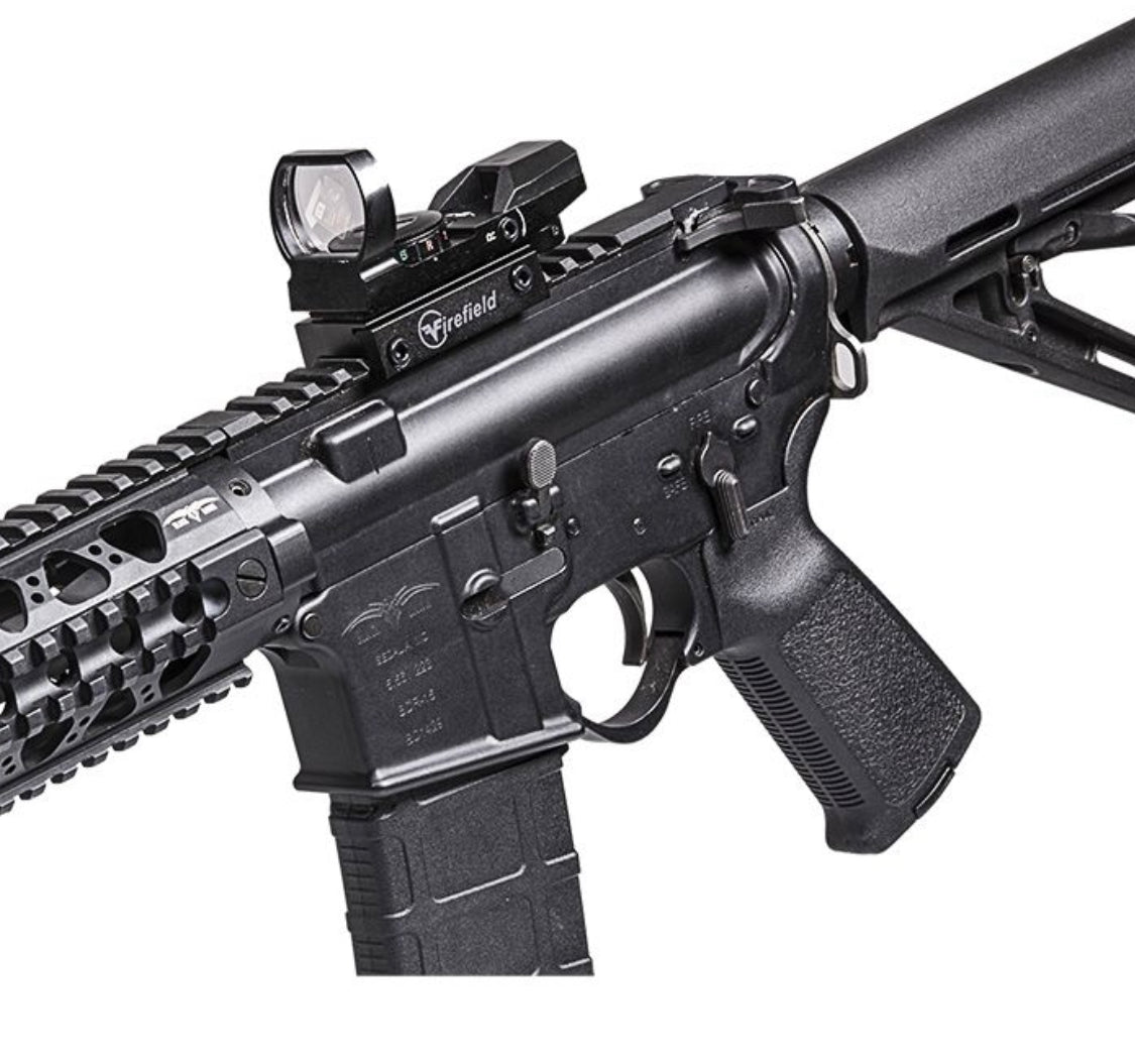 Close-up of a Firefield Multi Red Green Reflex Sight #FF13004 mounted on a black tactical firearm, showcasing sleek design.