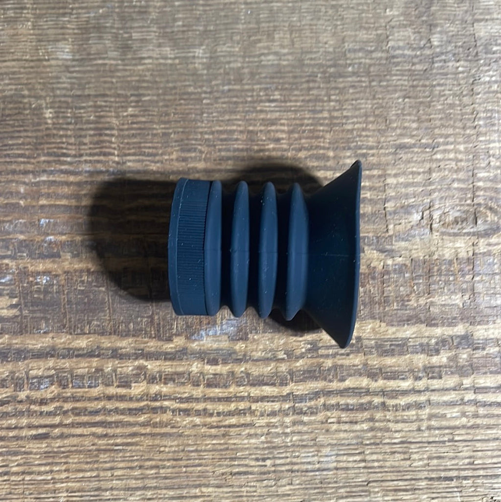 Black eyecup with red Pulsar logo, designed for thermal scopes, mounted on a rifle.