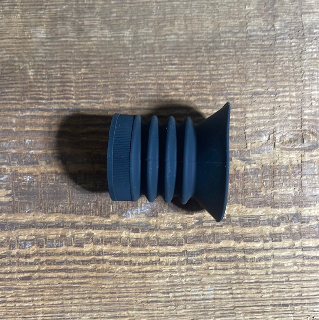 Black eyecup with red Pulsar logo, designed for thermal scopes, mounted on a rifle.