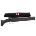 Black scope cover with Hornady logo on a rifle scope in a gun case by Hornady